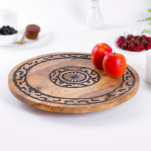 Handcrafted Wooden Plate with Intricate Black Carving